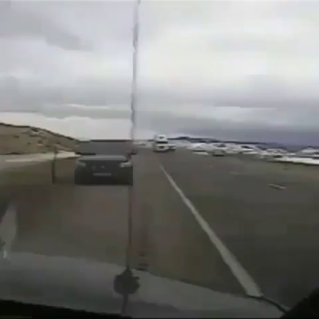 Wind Blows Truck on Top of Police Car in Wyoming USA